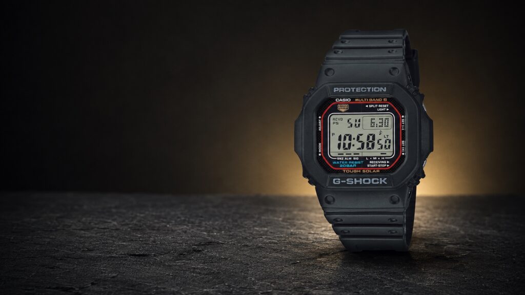 Black Casio G-Shock GW-M5610U-1ER with its branded square digital face in a dark studio setting.