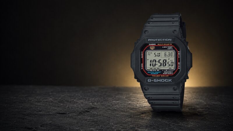 Black Casio G-Shock GW-M5610U-1ER with its branded square digital face in a dark studio setting.