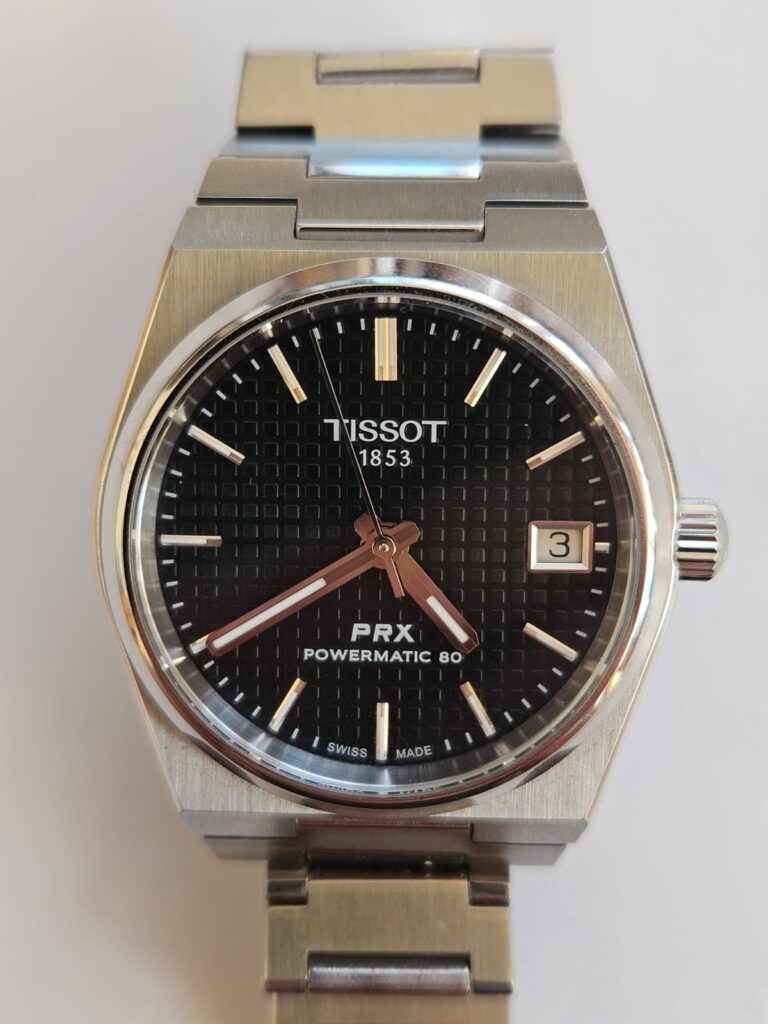 Black-dial Tissot PRX 35mm Powermatic 80 on its steel bracelet, photographed by Soulreaper.